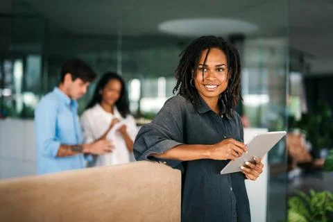Group of young multi-ethnic startup business team collaborating on project in Stock Photos