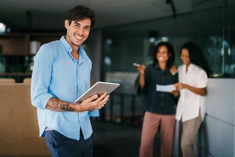 Group of young multi-ethnic startup business team collaborating on project in Stock Photos