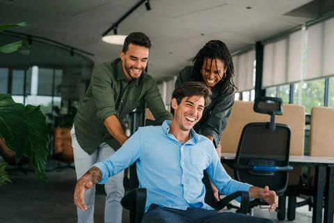 Group of young multi-ethnic startup business team collaborating on project in Stock Photos