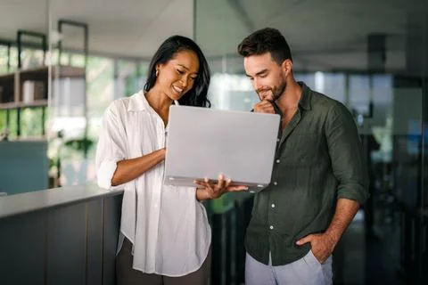 Group of young multi-ethnic startup business team collaborating on project .. Stock Photos