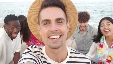 Group of young multiethnic friends taking a selfie and having fun at the beach Stock Footage 197109860