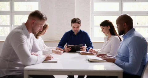 Group Of Young Multiethnic People Reading Bible Over Wooden Stock Footage 240842230