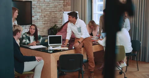 Group of young multiethnic start up partners, business people work together at Stock Footage 194141453