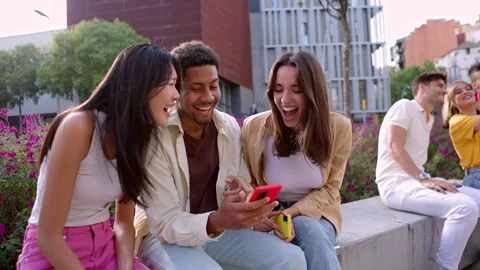 Group of young net generation friends having fun using cellphones outdoors Stock Footage 251434687