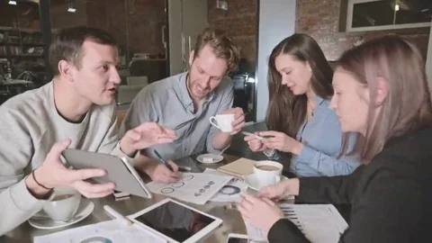 Group of young people in business meeting showing teamwork. Startup Stock Footage