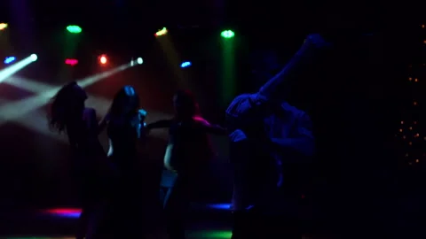 Group of young people dancing in dark. Silhouette Stock Footage 86161172