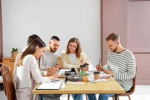 Group of young people during courses of calligraphy Stock Photos