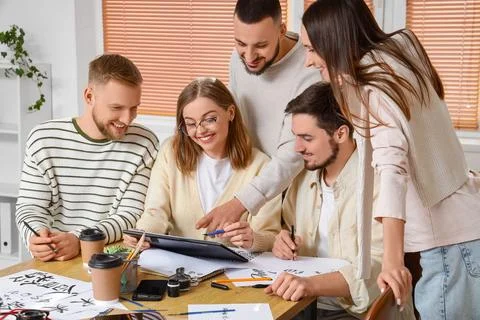 Group of young people during courses of calligraphy Stock Photos