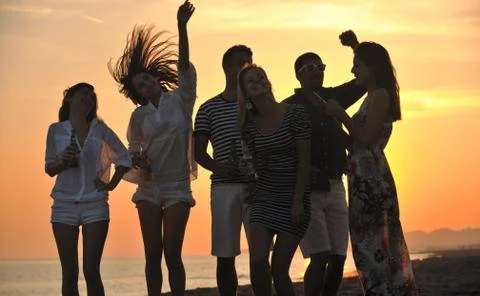 Group of young people enjoy summer  party at the beach Stock Photos