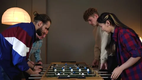 Group of Young People Having Fun Playing in Table Soccer at the Office Stock Footage 150290464