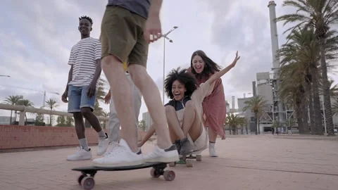 Group of young people having fun skateboarding in the city. Millennial friends Video stock 170402628