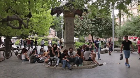 A group of young people having a rest in a city park. Stock Footage 79890674