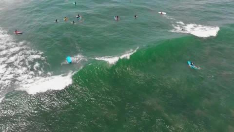 A group of young people learn to surf off the coast in Bali. 4K Video Footage Video stock 152723042