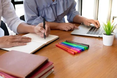 Group of young people learning studying lesson in library during helping teac Stock Photos