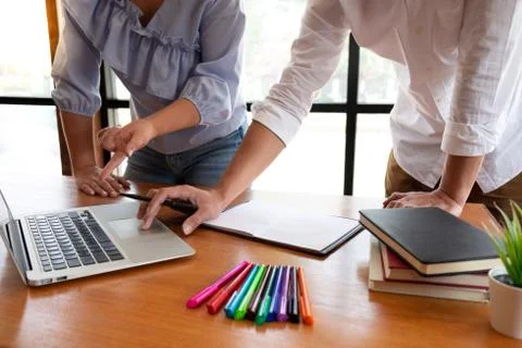 Group of young people learning studying lesson in library during helping teac Stock Photos