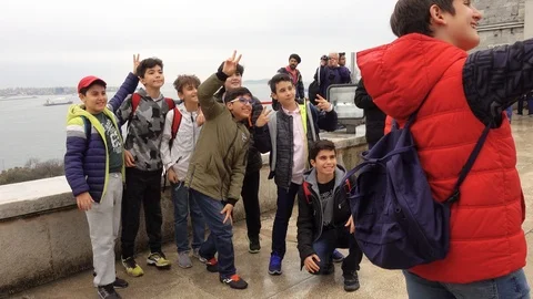 A group of young people is making selfies. Stock Footage 88104764
