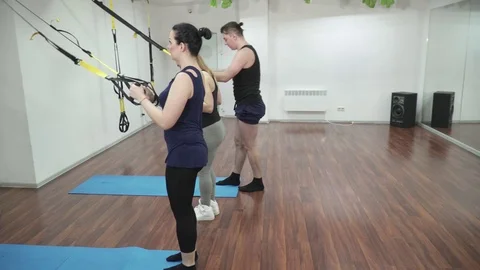 Group of young people making the step forward lunge with T-Fly Stock Footage