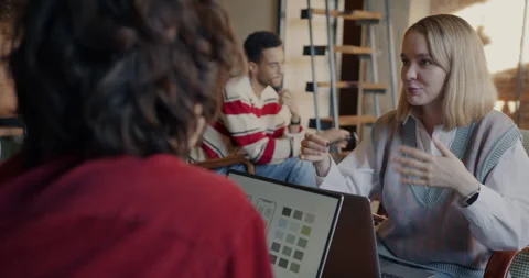 Group of young people mobile application developers working with laptop and Stock Footage 273501064