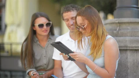 Group of Young People with Notes, Pens and Tablet Spending Time Outside Stock Footage 86515317