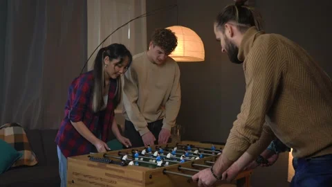 Group Of Young People Playing Table Soccer In The Office Stock Footage 150290101