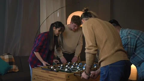 Group Of Young People Playing Table Soccer At Home Stock Footage 150290205