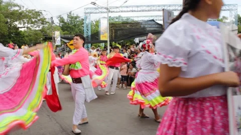 A group of young people practicing choreography at a parade Stock Footage 312410343