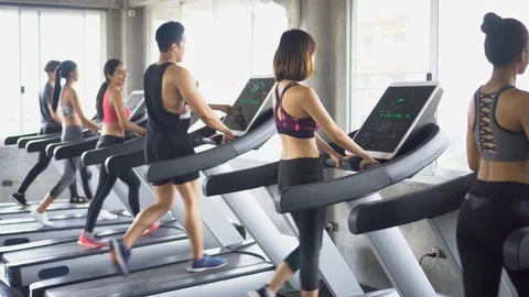 Group of young people running on treadmills in sport gym .fitness woman runne Stock Footage 112277697