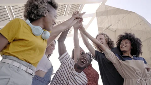 Group of young people stacking hand. Multiethnic group of students celebrating Stock Footage 160442248