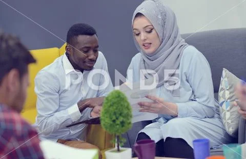 Group of young people, Startup entrepreneurs working on their venture in Stock Photos