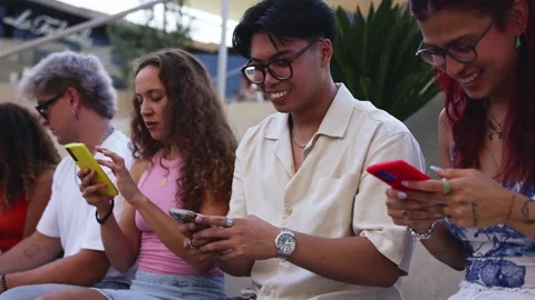 Group of young people using smartphones together outdoors Stock Footage 315875215