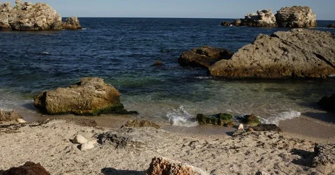 Group of Young People Walking Beach Shoreline Red Rocks Coast Holidays Activity Stock Footage 70686755