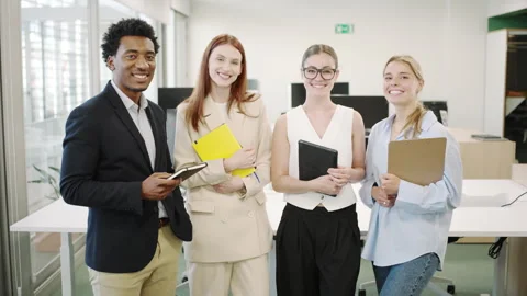A group of young professionals in a modern office working together on a project Stock Footage 278713344