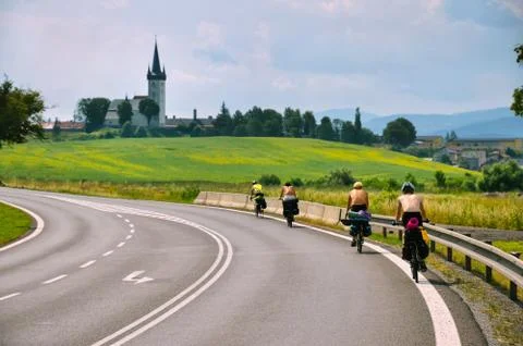 Group of young riders on bicycle ride near by famous castle in Slovakia. Stock Photos