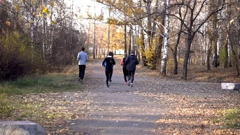 A group of young runners running Stock Footage 99323658