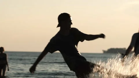 Group of young students on beach, friends happy relax having fun playing on Stock Footage 168615733