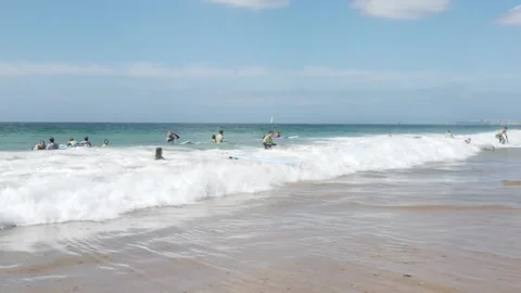 Group of young surfers at Carcavelos beach near Lisbon, Portugal Stock Footage 250472141