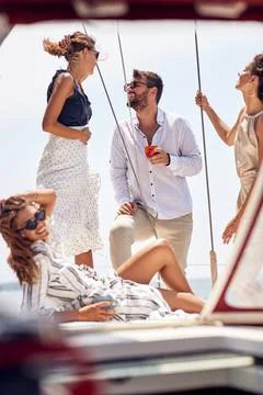 A group of young thoughtful handsome models is having a wonderful time on the Stock Photos