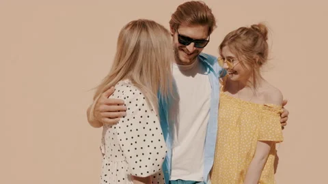 Group of young three stylish friends posing in the street Stock Footage 142301552
