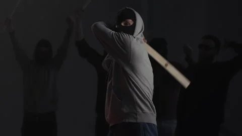 Group of young vandals terrorists or masked protesters clash with authorities Stock Footage 132108351