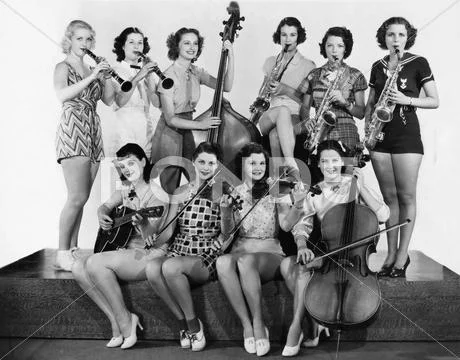 Group Of Young Women Playing Instrument