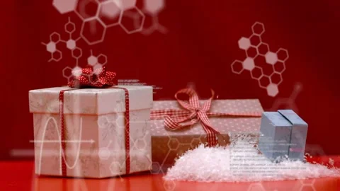 Grouped gifts moving on red tabletop, small blue box entering right, tipping Stock Footage 323119087