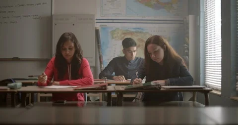 Groupl of students work on homework in classroom, 4K Stock Footage 118141914