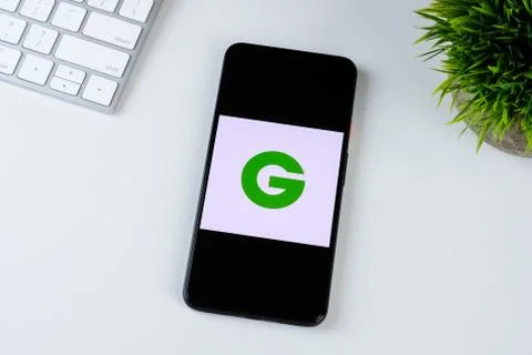 Groupon app logo on a smartphone screen Stock Photos