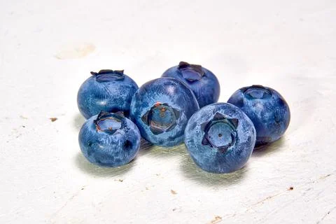 Groups of fresh blueberries isolated on a light background Stock Photos