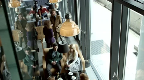 Groups of people sitting and chatting at a cafe. Stock Footage 61157966