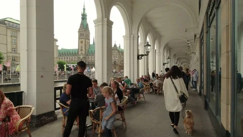 Groups of people walking and drinking in cafe in city center Video stock 159283464