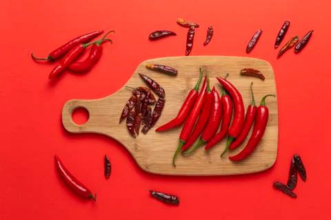Groups of red chilli peppers and dried asian hot capsicum Stock Photos