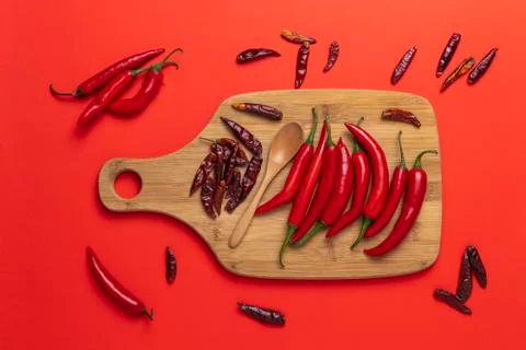 Groups of red chilli peppers and dried asian hot capsicum on the wooden Stock Photos