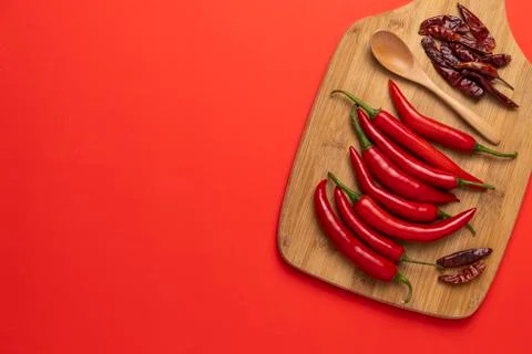 Groups of red chilli peppers and dried asian hot capsicum Stock Photos