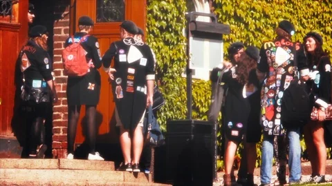Groups of students in black jackets covered with patches and wearing Stock Footage 109463781
